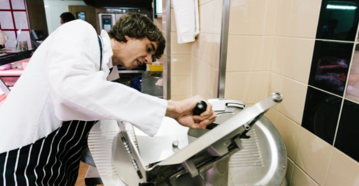 staff using meat slicer staff using meat slicer